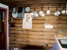 Kitchen is in the enclosed back porch.  This shot shows the original beaded weatherboards.
