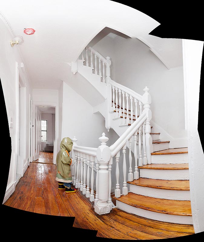There's a center spiral staircase (a bit wobbly in parts) that divides the top three floors into front/back, and lets light into the middle of the house.  Amazingly, no missing spindles, though of course they all have a million coats of paint on them.