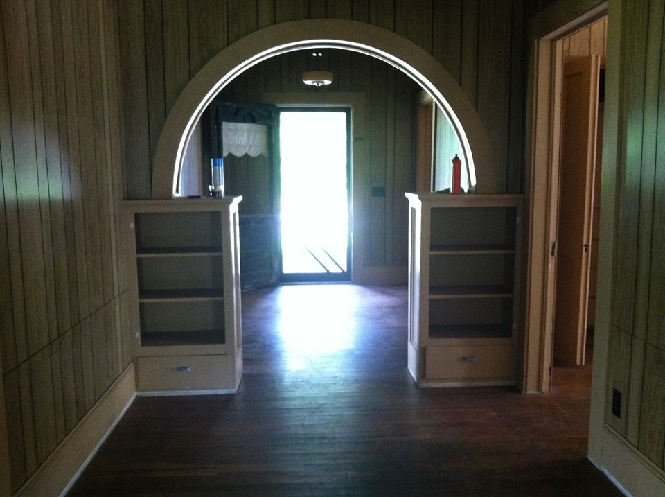 This is our hallway looking towards the front door. The doors are missing off of the built ins.