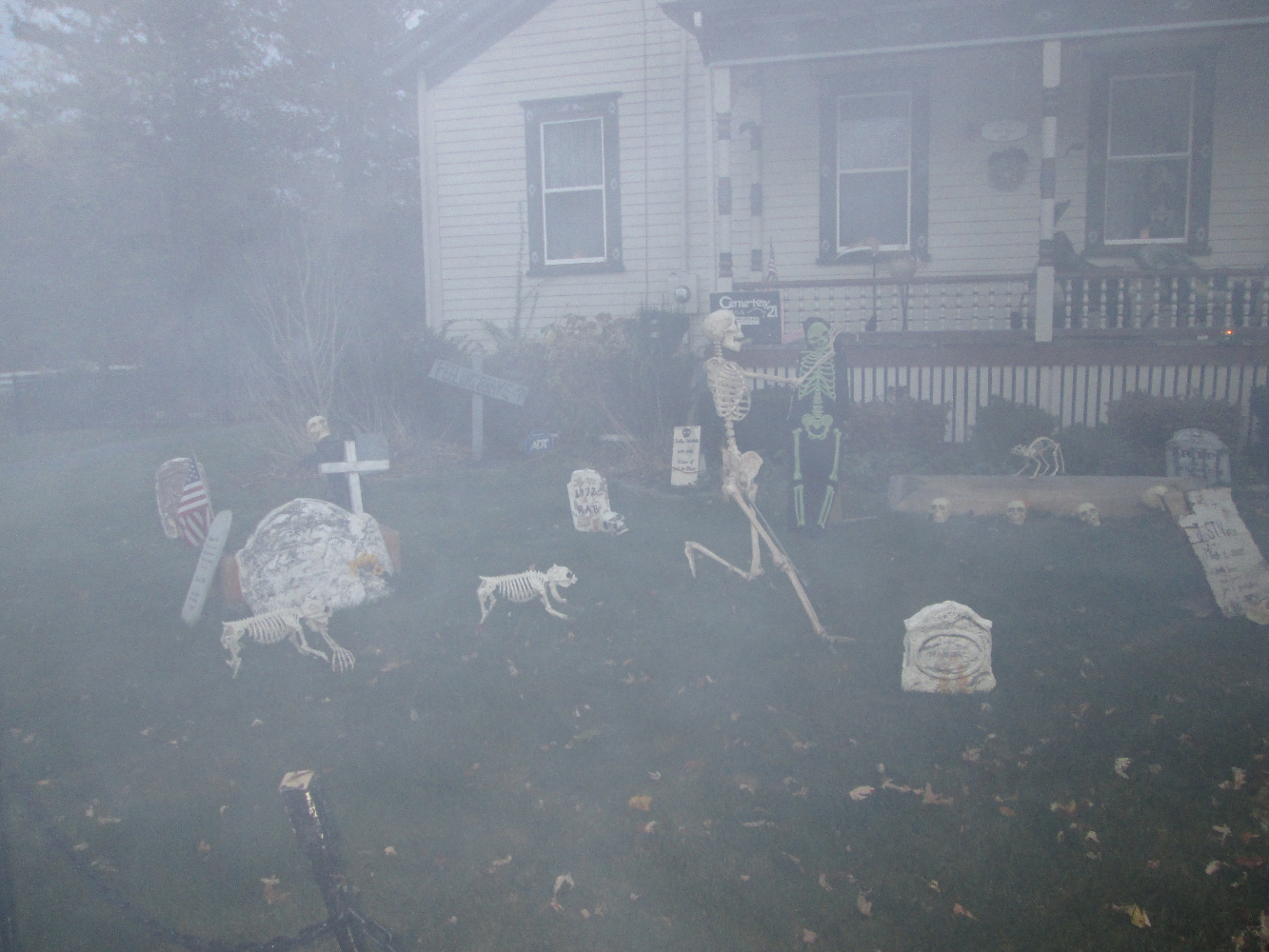 The yard in fog. We put real candles in jars for a real effect.