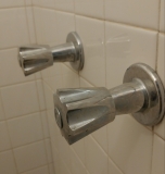 Shower stall faucets