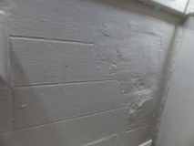 Subway tile effect in plaster. Poor finish in a past repair job.