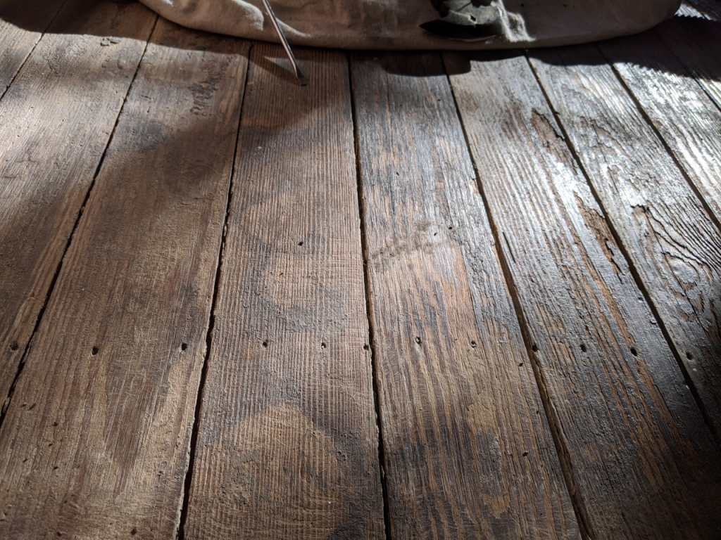 Sleeping porch raw wood floor